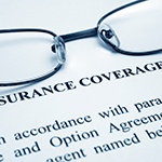 Wire framed glasses at top of insurance coverage info page