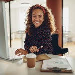 Woman smiling while working in office